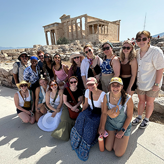 Students standing outside of the Parthenon