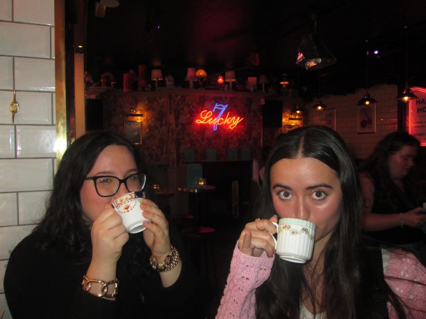 two girls drinking tea
