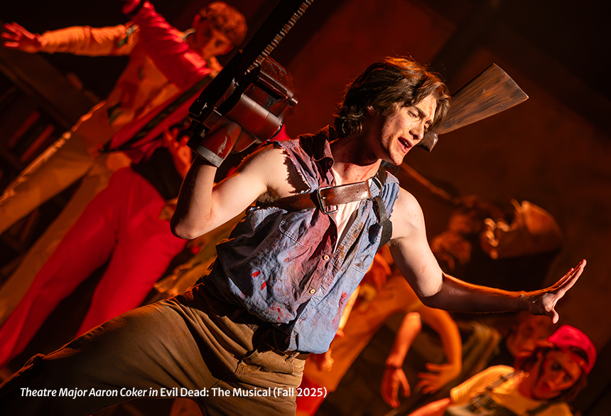 A man with a chainsaw hand singing while a group of zombies dance around him.