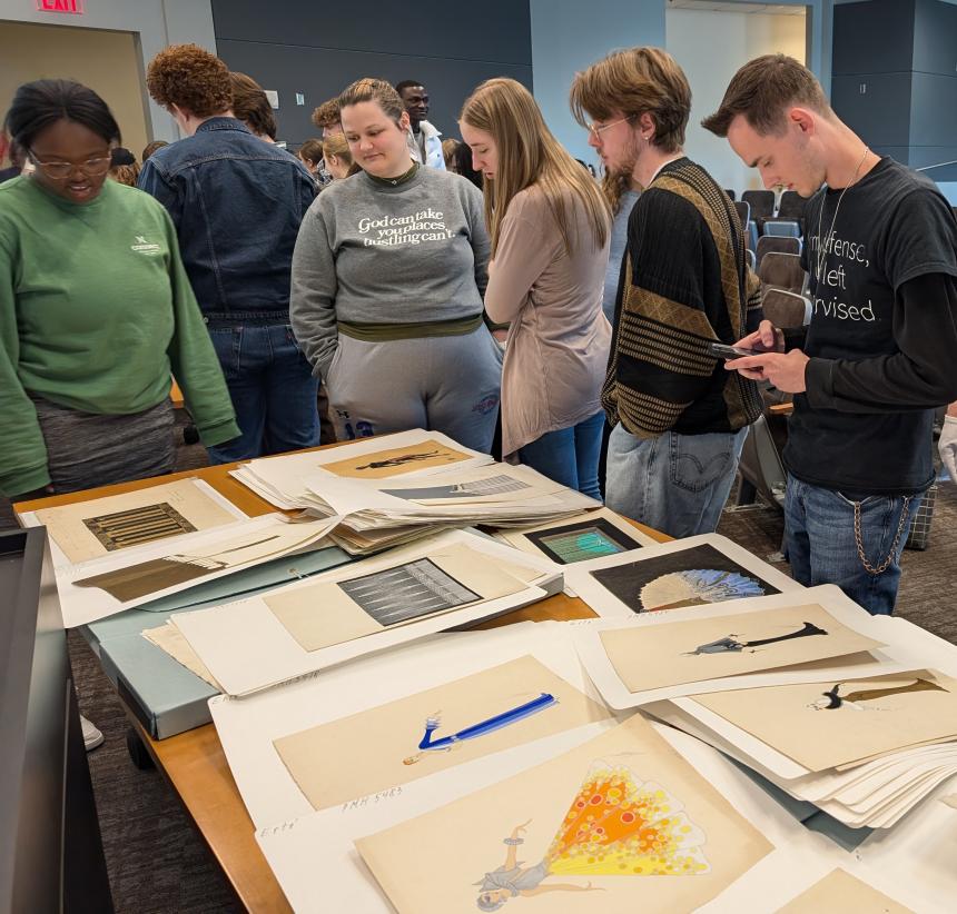 Students looking at exhibit pieces