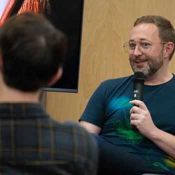 A man holding a microphone.