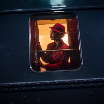 A woman looking out of a train window