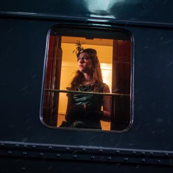 A woman looking out of a train window